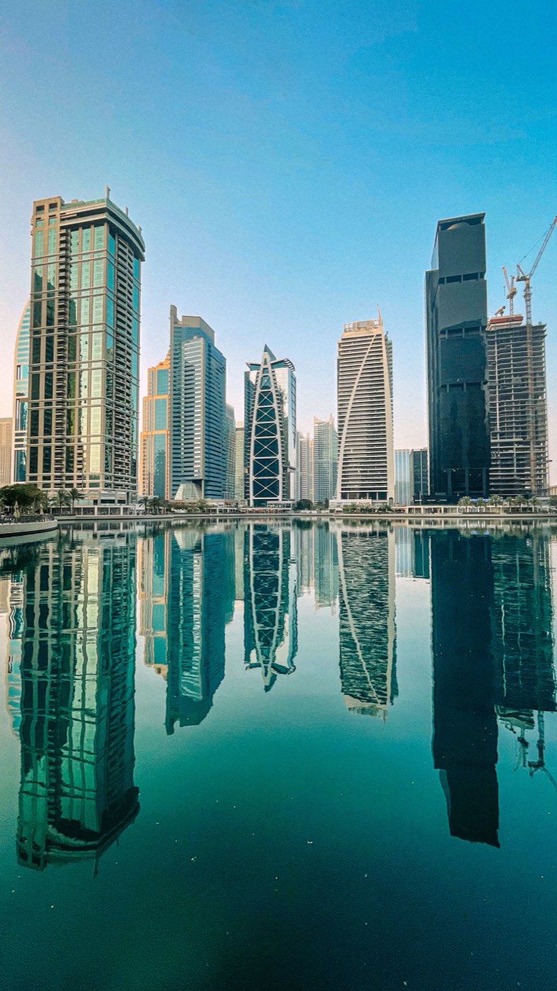 Residential towers reflected in the lake