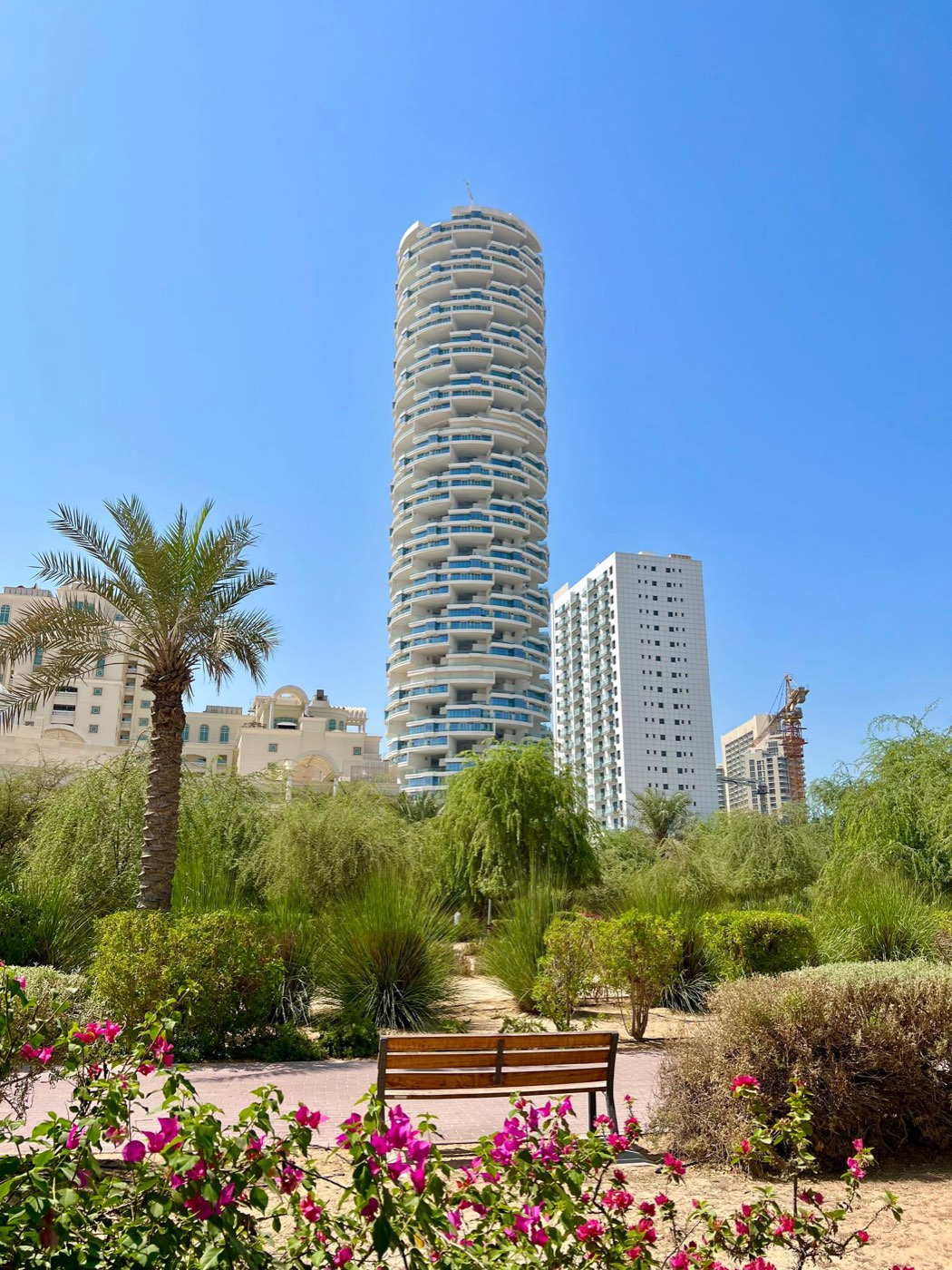 Residential tower above a green park in Dubai